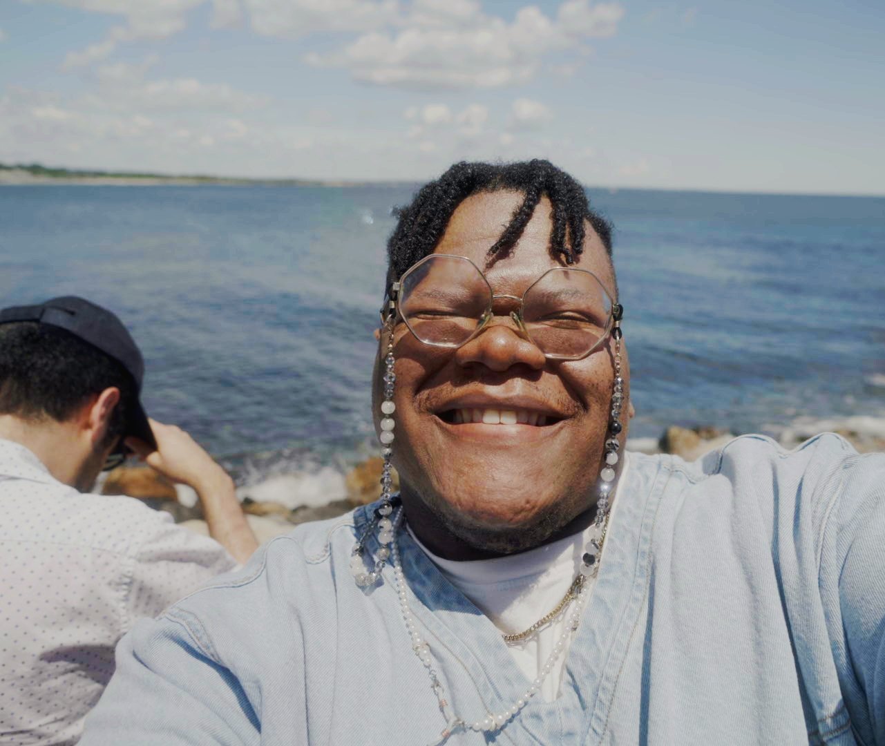 David Ike, smiling, by the water